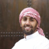 Young smiling handsome arabian man wearing traditional clothes